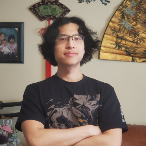A professional portrait of Tony Pau.